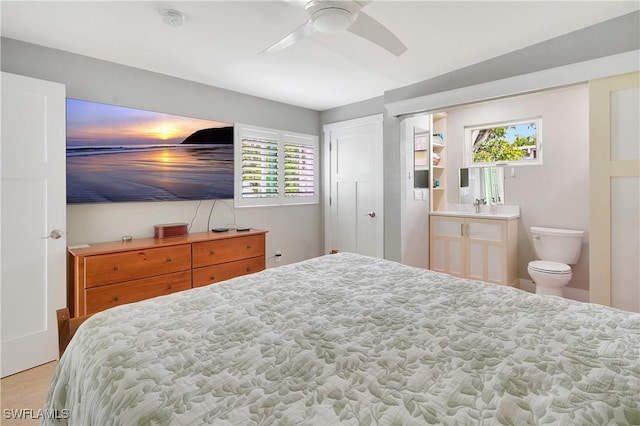 bedroom with ceiling fan and a sink