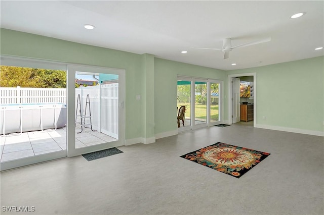 doorway to outside with ceiling fan, baseboards, and recessed lighting