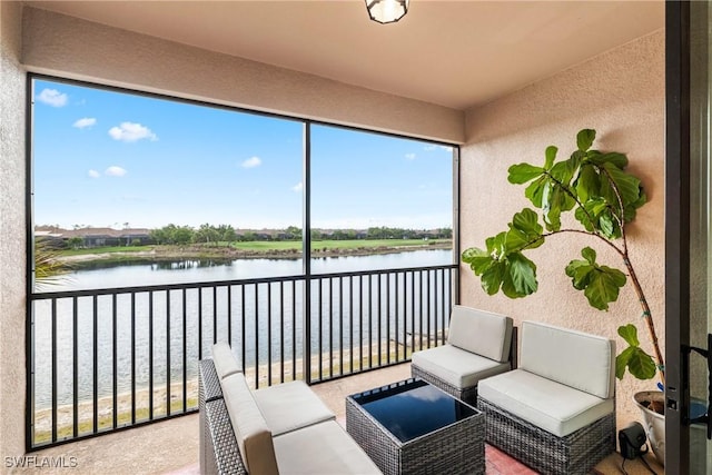 sunroom / solarium with a water view