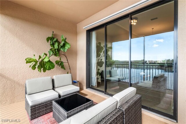 view of patio / terrace featuring outdoor lounge area and a water view