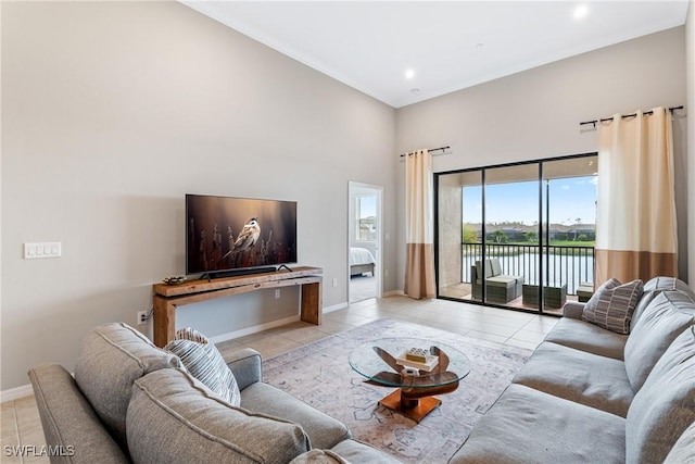 living room with light tile patterned flooring, recessed lighting, and baseboards