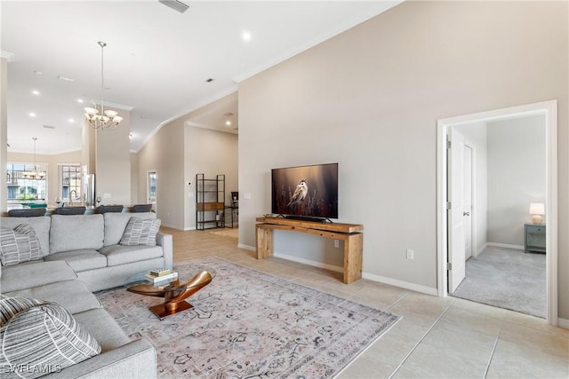 9365 Pocida Ct Unit 203, Naples, FL 34119 - living room with a chandelier, light tile patterned flooring, ornamental molding, high vaulted ceiling, and baseboards