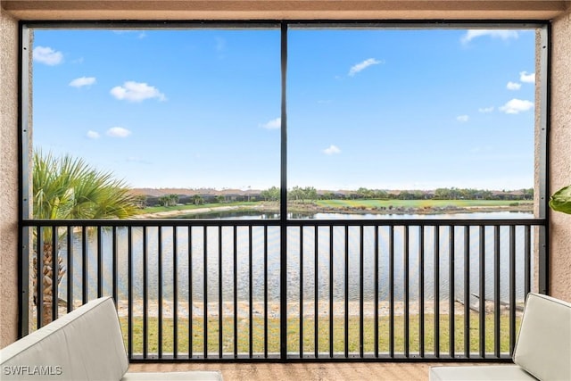 balcony featuring a water view