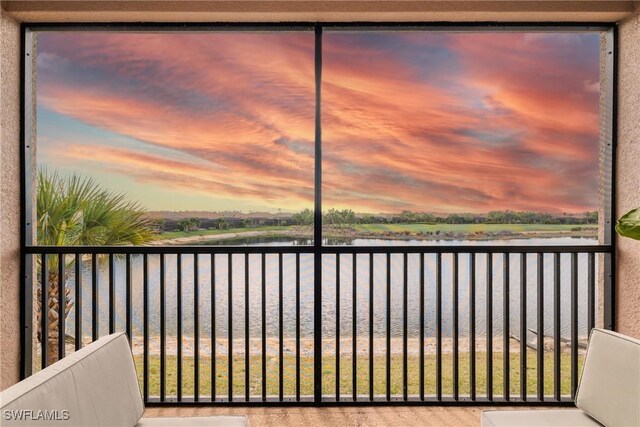 balcony featuring a water view