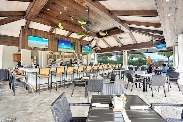 view of patio / terrace featuring a gazebo, outdoor dining space, outdoor dry bar, and ceiling fan