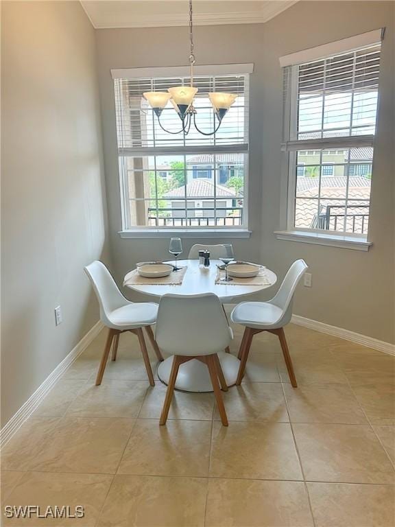 9365 Pocida Ct Unit 203, Naples, FL 34119 - dining room featuring ornamental molding, healthy amount of natural light, a chandelier, baseboards, and light tile patterned floors