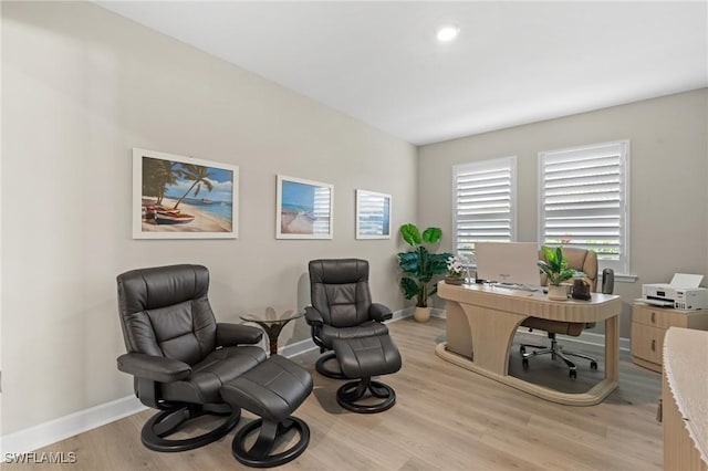 office space featuring light wood finished floors and baseboards