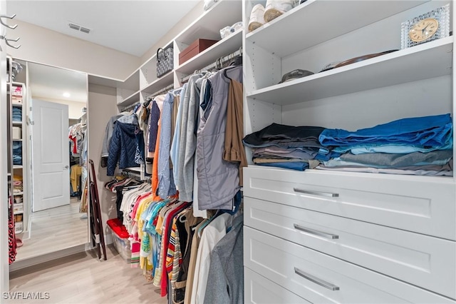 walk in closet with visible vents and light wood finished floors