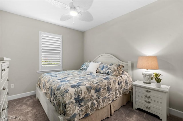 bedroom with dark colored carpet, ceiling fan, and baseboards