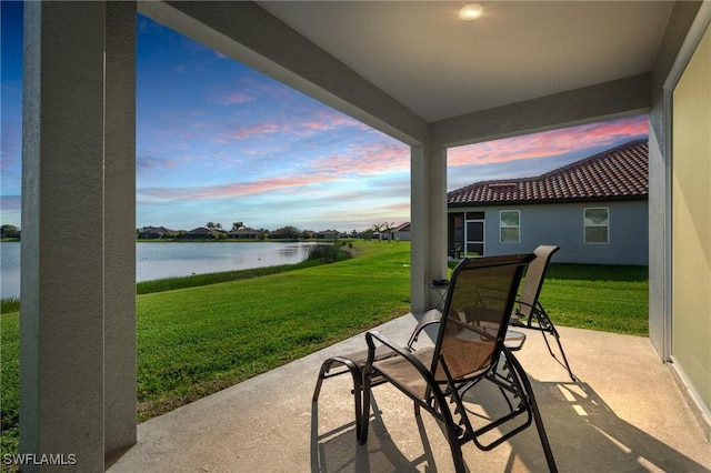 view of patio / terrace with a water view