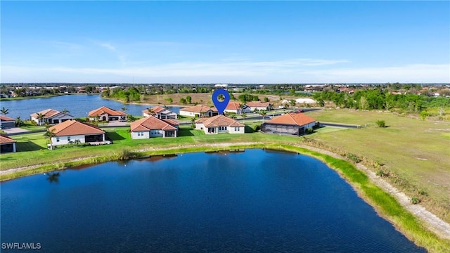 birds eye view of property with a residential view and a water view