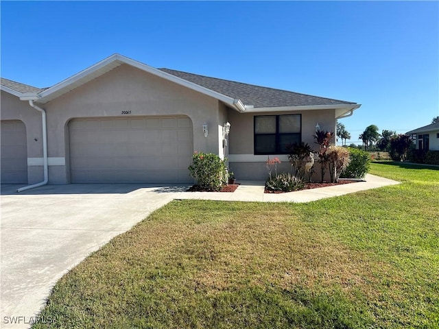 ranch-style house featuring stucco siding, a shingled roof, a garage, driveway, and a front lawn