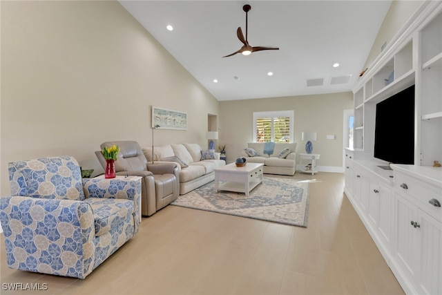 living area featuring light wood finished floors, ceiling fan, high vaulted ceiling, and recessed lighting