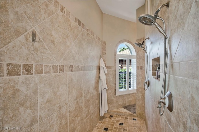 full bath with a tile shower