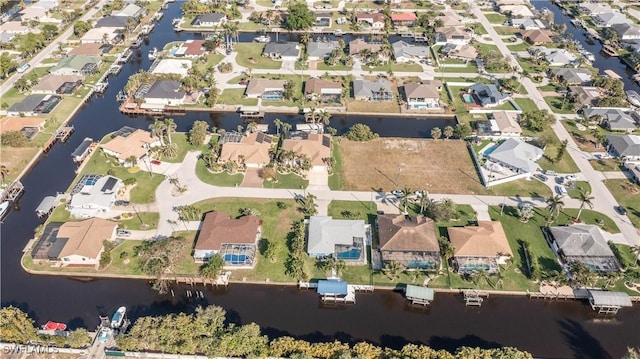 bird's eye view with a water view and a residential view