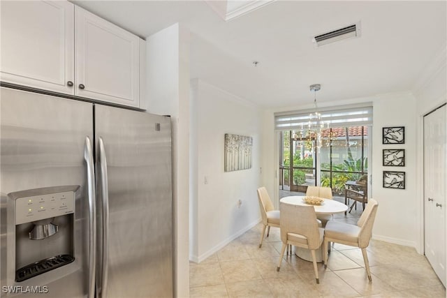 dining area with light tile patterned floors, visible vents, and ornamental molding