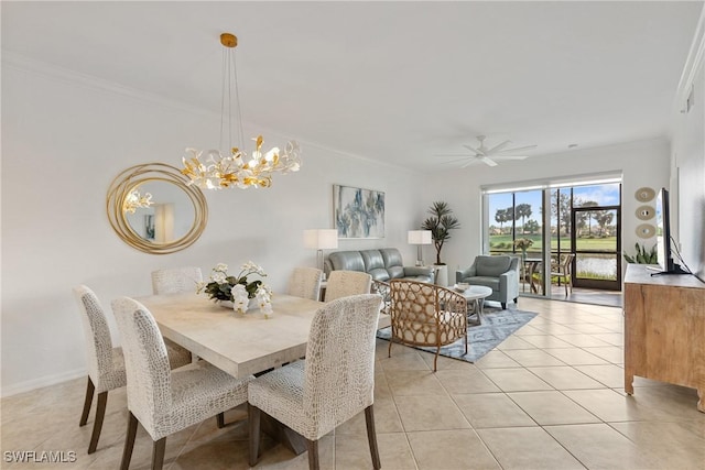 dining area featuring light tile patterned floors, baseboards, and crown molding