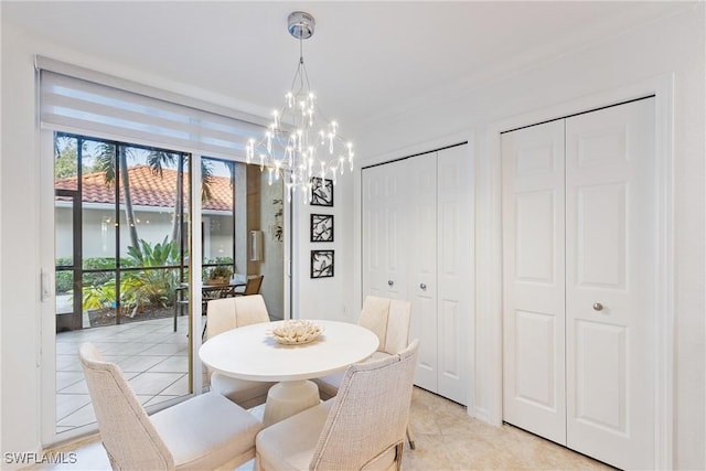 dining area featuring light tile patterned flooring and a notable chandelier