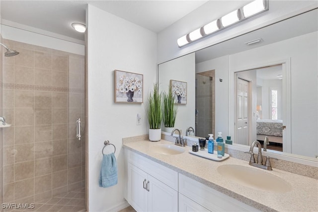 ensuite bathroom featuring ensuite bath, a sink, visible vents, and a shower stall