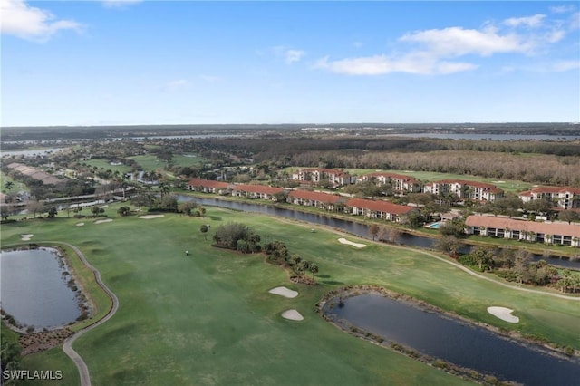 bird's eye view with view of golf course and a water view