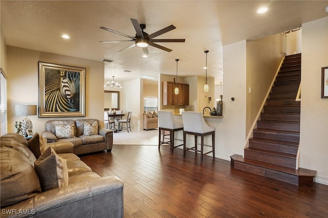 living room with recessed lighting, visible vents, stairway, dark wood-type flooring, and a ceiling fan