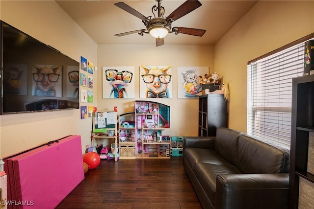 rec room featuring ceiling fan and dark wood-type flooring