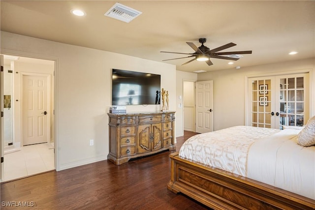 bedroom featuring dark wood-style floors, french doors, visible vents, and recessed lighting