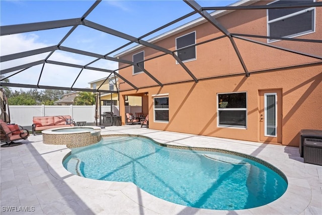 view of pool with a fenced in pool, a patio area, fence, an in ground hot tub, and a lanai