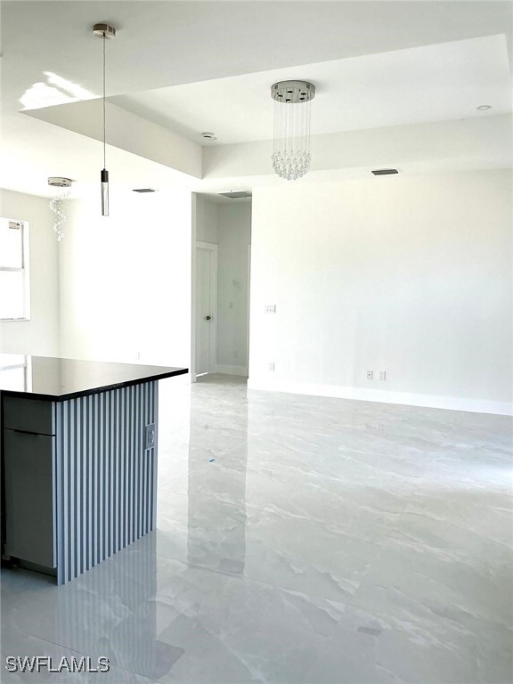 empty room featuring visible vents and baseboards