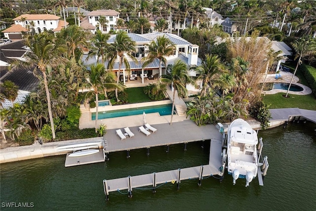 bird's eye view featuring a water view and a residential view