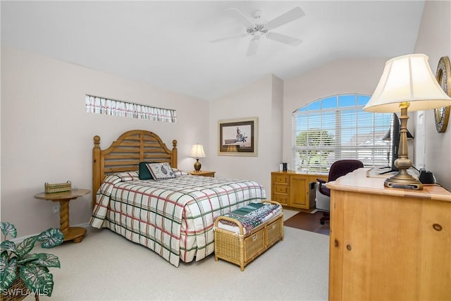 bedroom with a ceiling fan, carpet, and vaulted ceiling