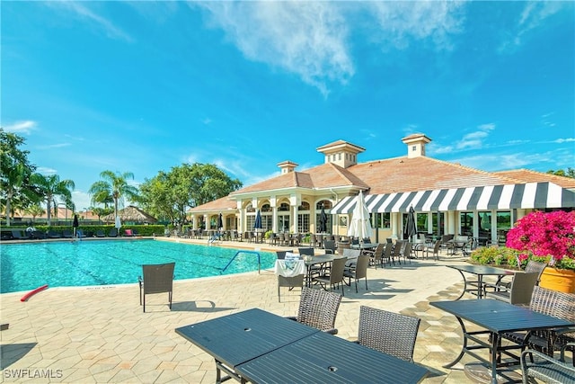 community pool featuring a patio area