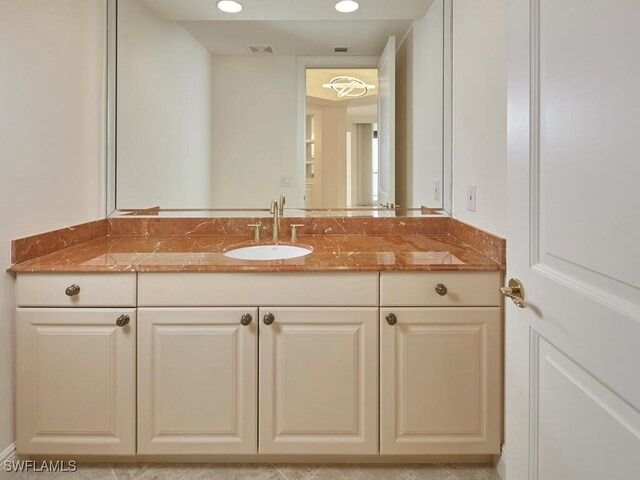 bathroom with recessed lighting, visible vents, and vanity