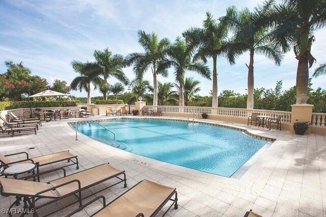 pool with a patio area