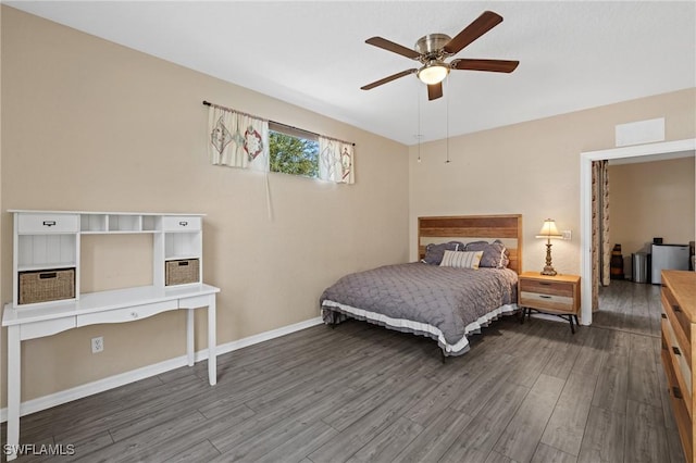 bedroom with ceiling fan, baseboards, and wood finished floors