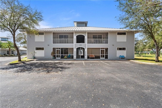 view of property featuring uncovered parking