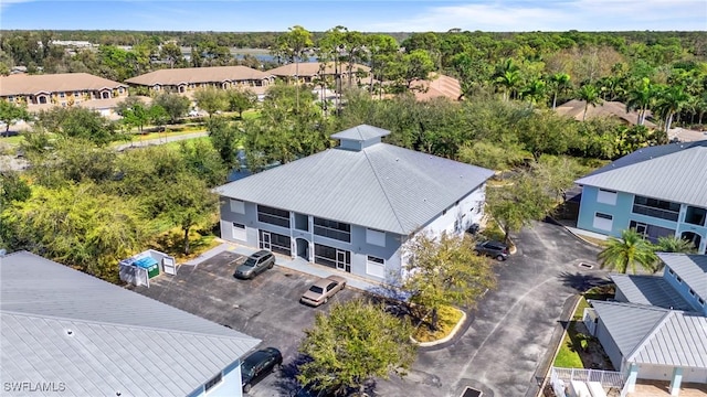 birds eye view of property with a residential view