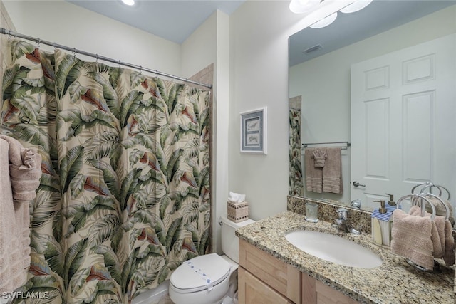 bathroom with visible vents, a shower with shower curtain, vanity, and toilet