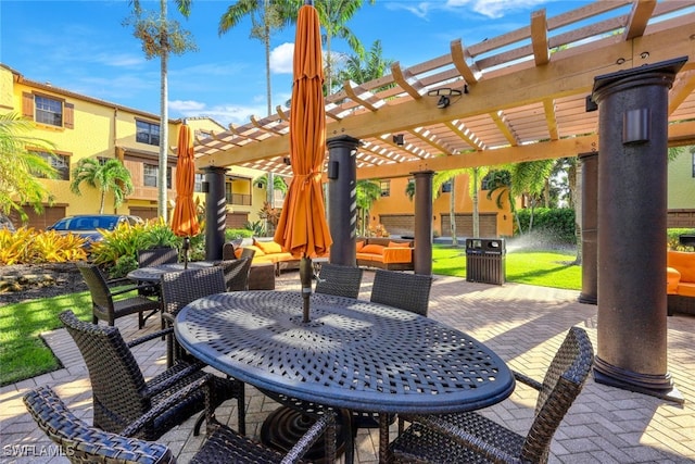 view of patio / terrace with outdoor dining space and a pergola