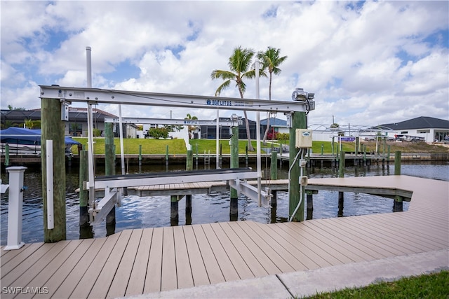 view of dock featuring a water view and boat lift