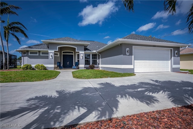 prairie-style home featuring an attached garage, driveway, a shingled roof, and stucco siding