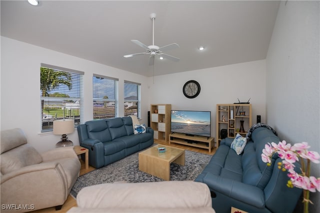 living room with ceiling fan and wood finished floors