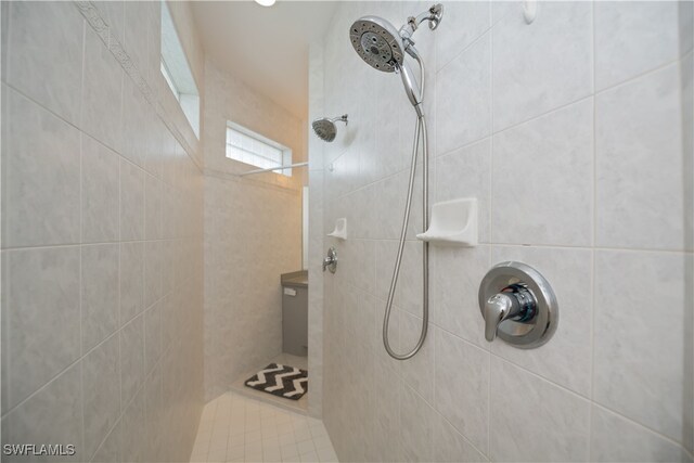 full bath with tiled shower