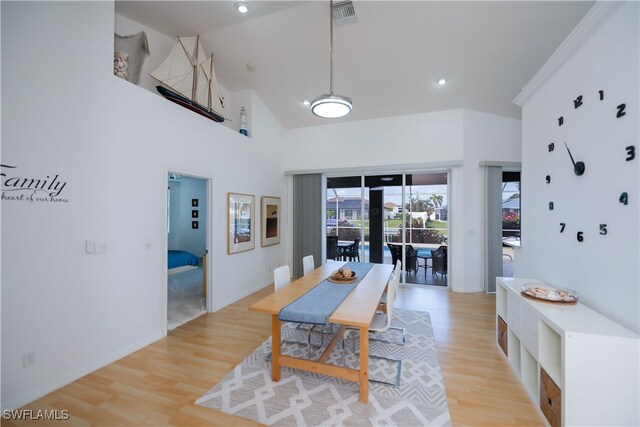 dining room featuring high vaulted ceiling, recessed lighting, visible vents, baseboards, and light wood finished floors