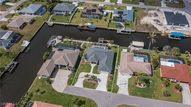 bird's eye view featuring a water view and a residential view