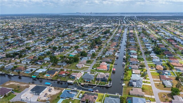 aerial view with a residential view and a water view