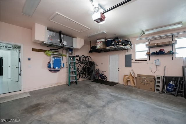 garage featuring a garage door opener and electric panel