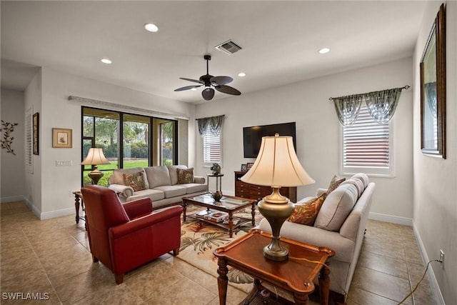 living area with recessed lighting, visible vents, a ceiling fan, light tile patterned flooring, and baseboards