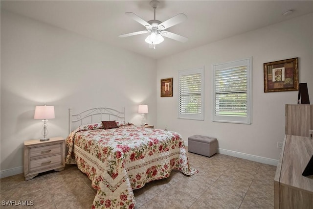 bedroom featuring ceiling fan, baseboards, and light tile patterned flooring