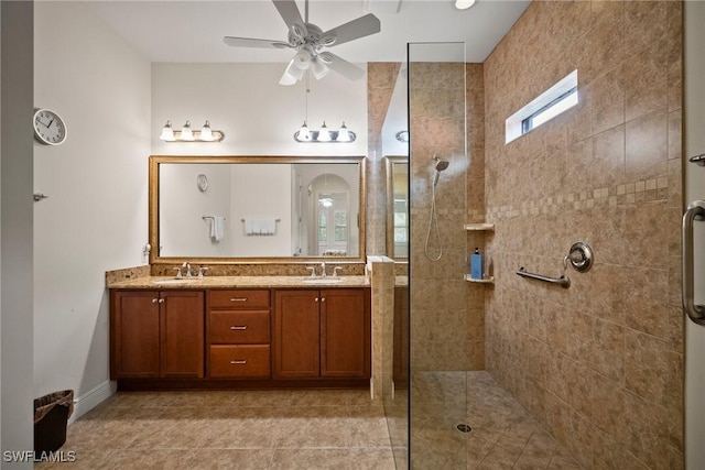 full bath featuring a walk in shower, double vanity, a sink, and a ceiling fan